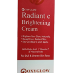 Oxyglow Radiant C Brightening Cream packaging featuring Vitamin C, Kojic Acid, and Niacinamide for dark spot correction and skin brightening.