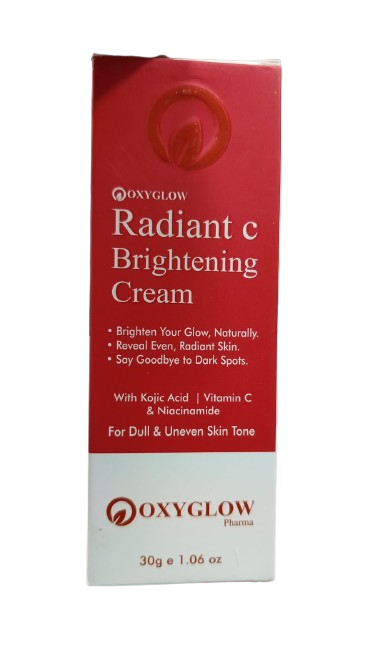 Oxyglow Radiant C Brightening Cream packaging featuring Vitamin C, Kojic Acid, and Niacinamide for dark spot correction and skin brightening.